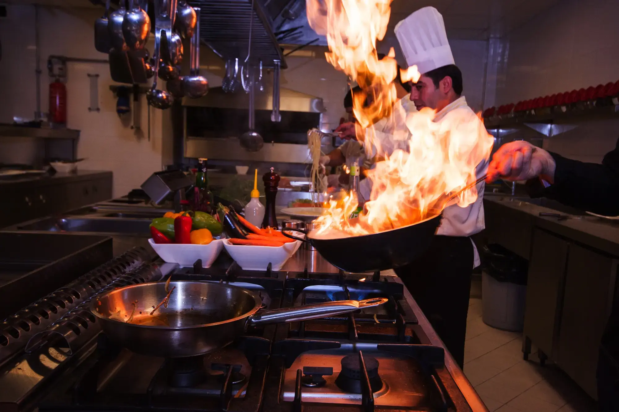 Chef cooking in a commercial kitchen, from TotalEnergies